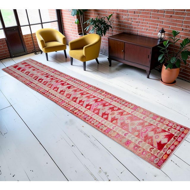 This exceptionally long 1960s Southeastern Anatolian runner rug is a masterful representation of vintage tribal weaving,...
