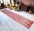 This exceptionally long 1960s Southeastern Anatolian runner rug is a masterful representation of vintage tribal weaving,...