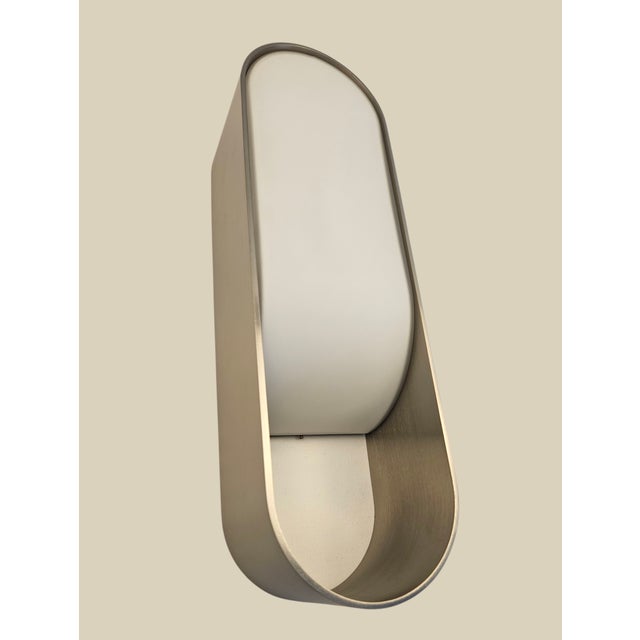 Brand new matching pair (2) of Boyd Lighting Loop LED Wall Sconces in a sleek Satin Nickel finish with softly tapered...