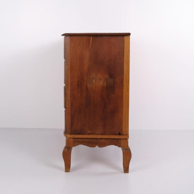 Large antique Baroque chest of drawers crafted from oak with a curved front and straight central break. The chest was made...