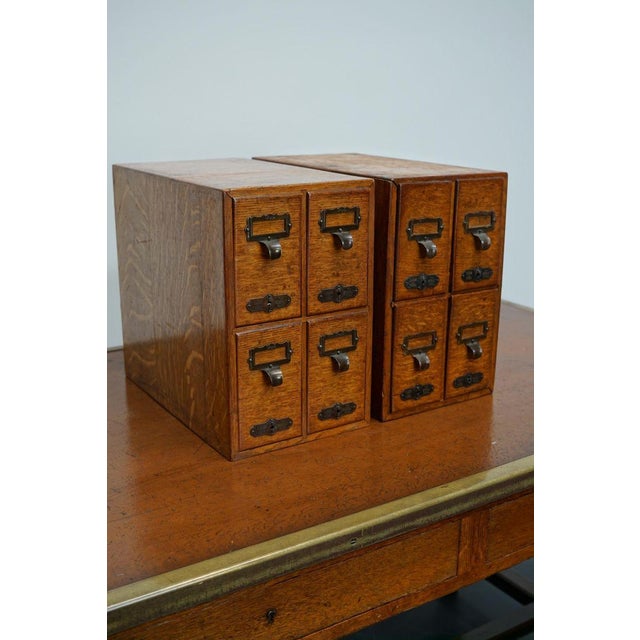 Very nice pair of small french oak filing cabinets with brass hardware made in paris in the early 20th century. It is very...