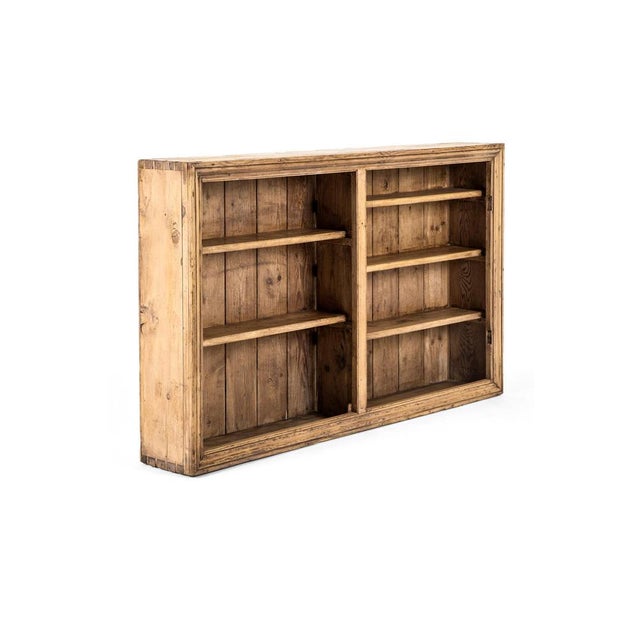 A wonderful victorian pitch pine larder cupboard with an arrangement of shelves split into two sections. The shelving...