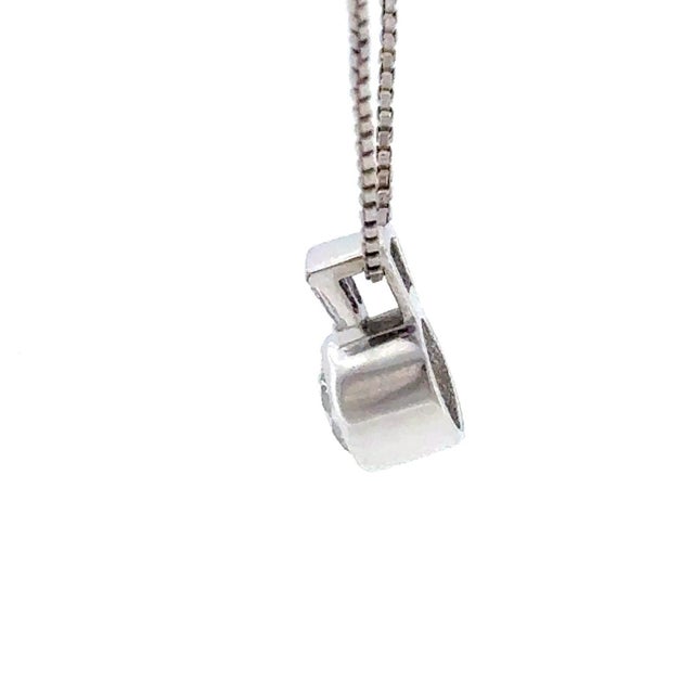 This elegant necklace features a sophisticated combination of round and baguette-cut diamonds, masterfully bezel-set in...