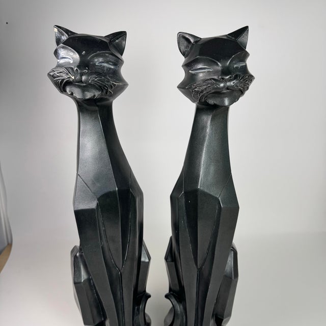 Add a bold sculptural statement to your space with this striking pair of vintage cubist cat sculptures featuring angular...
