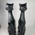 Add a bold sculptural statement to your space with this striking pair of vintage cubist cat sculptures featuring angular...