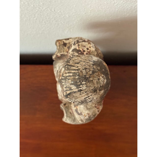 A wonderfully expressive antique santos figure featuring a hand-carved devotional form with traces of its original...