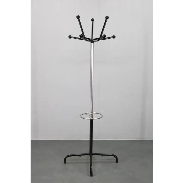 Coat rack made in Italy, 1970s, featuring a dynamic design with chrome-plated and lacquered iron construction complemented...