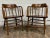 This is a pair of beautiful antique barrel back oak pub chairs or captain’s chairs, likely from the late 1800s or early...
