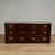 Handsome vintage campaign style chest crafted in mahogany with seven off set drawers, brass hardware and banding over...