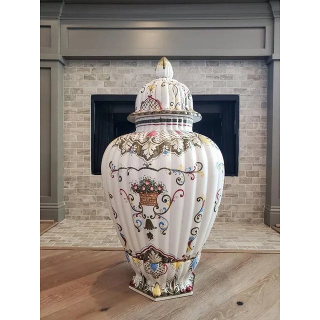 A magnificent and impressive sized vintage Italian hand painted lidded Fiori urn form vase. Exquisitely polychrome...