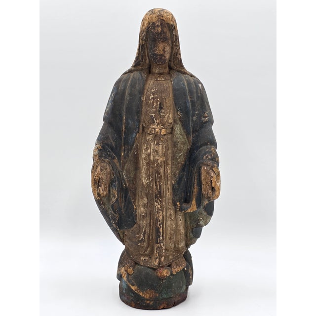 The product is an Antique 18th C Spanish Colonial hand-carved Virgin Mary statue made of polychrome wood. This unique...
