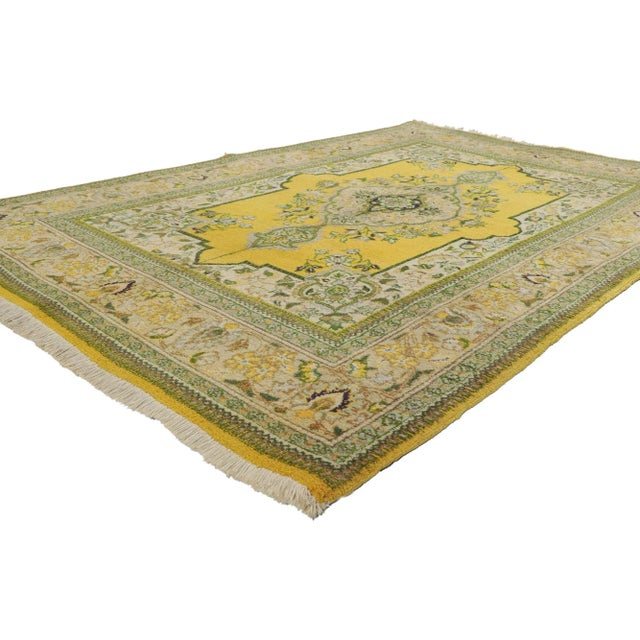 71908 Vintage Persian Tabriz Rug, 04’10 x 07’04. Cast off winter doldrums and dial up the cheer with this spring colored...