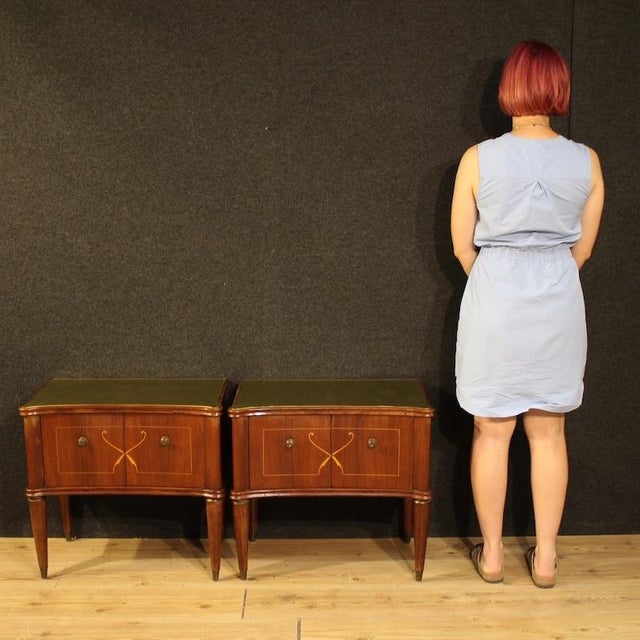 Pair of mid-20th-century Italian bedside tables. Carved, inlaid, and veneered in walnut, mahogany, maple, and fruitwood...
