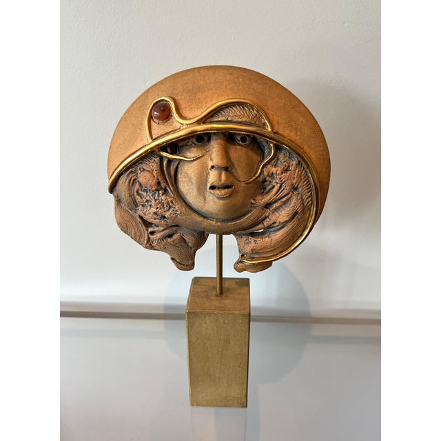 This unusual and interesting sculpture is made of terracotta. It is a Belgian work signed intaglio JVC and bearing a label...