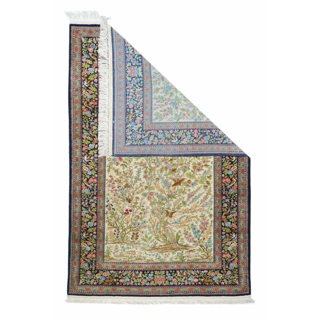 Various birds flutter among the stems, branches, flowers and foliage of the swaying composite trees on the sand ground of...