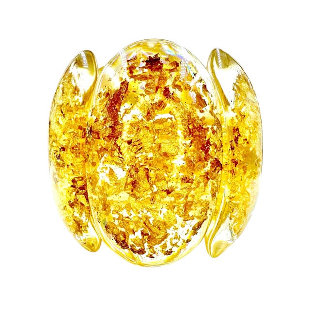 This elegant bracelet called Zeus is designed by Carlos Sobral and is part of the Metalique line*. The Clear lucite bangle...