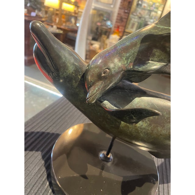 Original beautiful Bronze by James Bottoms of two Dolphin with child on base (removable) circa 1984 Signed and numbered...