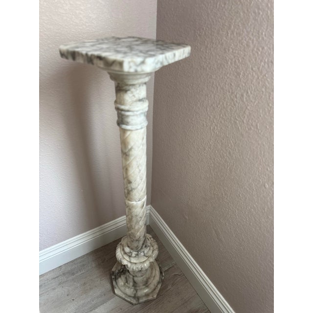 This stunning possibly antique Italian marble carved column pedestal display plant stand is a breathtaking piece of art...