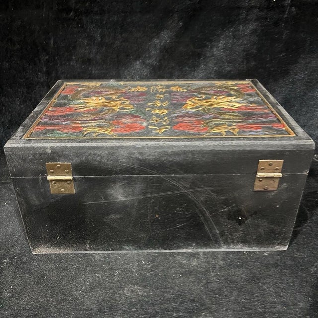 This is a magnificent vintage Chinese lacquer box, elaborately decorated with gilt painted dragons in the imperial style....