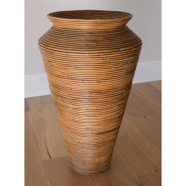 Nice vintage floor vase made of pencil reed rattan in the style of Gabriella Crespi. Perfect for any vintage boho inspired...