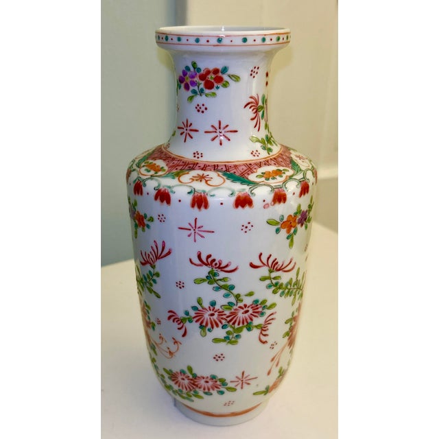 Famille Rose Chinese Vase. A truly beautiful, hand painted vase in vibrant colors and excellent condition. Makers Mark in...