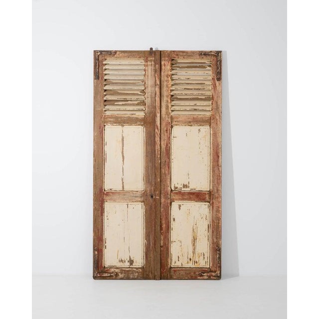 This enchanting pair of antique wooden shutters evokes the romance of a provincial chateau. Made in France in the 1800s,...