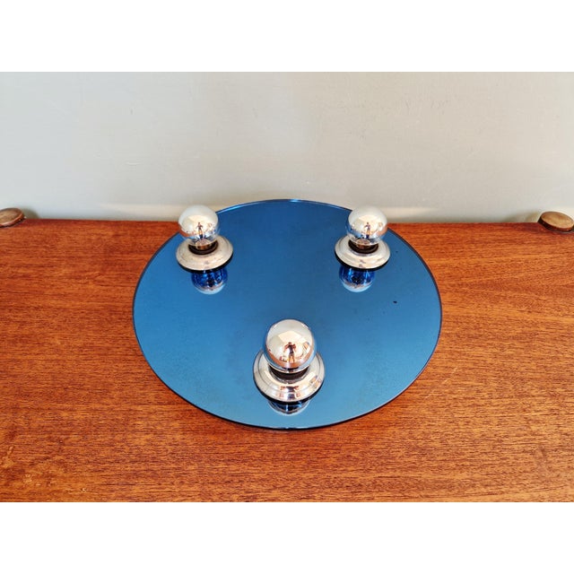 Space Age ceiling/wall light in chrome-plated metal and bluish reflective glass (mirror-type glass), 1970s. It is...