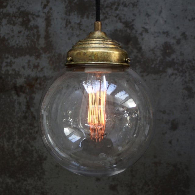 Small round clear glass pendant 2 meter black cotton wire brass top E26 / E27 Up to 250V (Europe/UK Standard).The wiring...