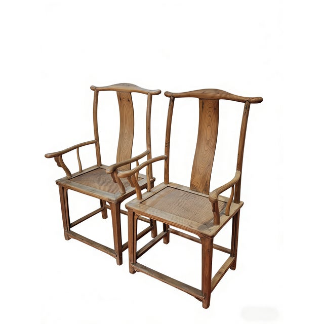 This 19th century pair of armchairs are classic examples of the Official's Hat (guānmàoyǐ) style. Made from solid elm,...