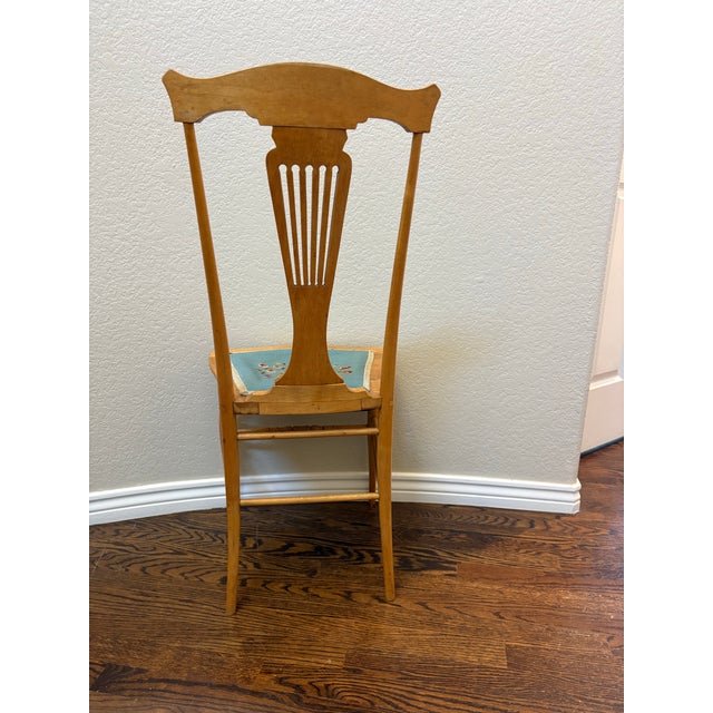 An exceptionally well-preserved antique side chair dating to approximately 1900, distinguished by its beautifully figured...