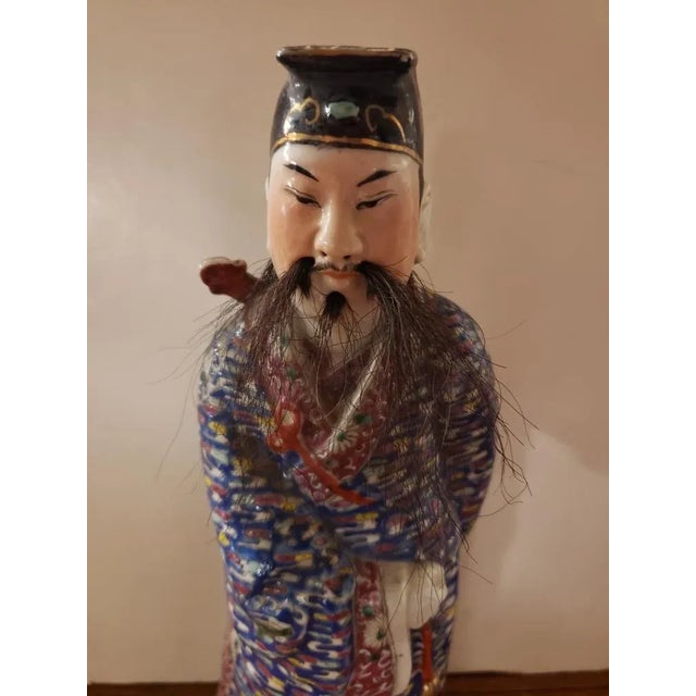 This Early 20th Century Chinese Porcelain Lu Dongbin Statue with Horse Hair for Facial Hair measures 13 1/2" high, 4 3/4"...