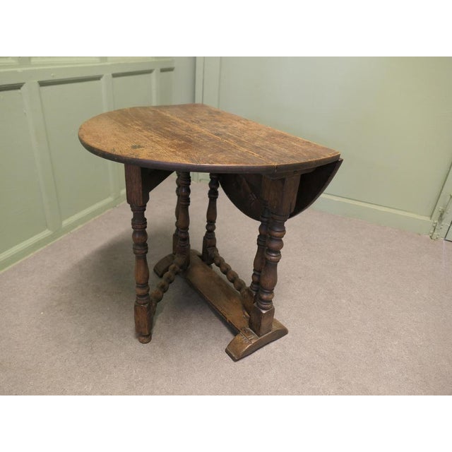 Small Georgian Oak Gate Leg Table The table has a solid oak top with turned legs it dates from around 1780 to 1800. A...