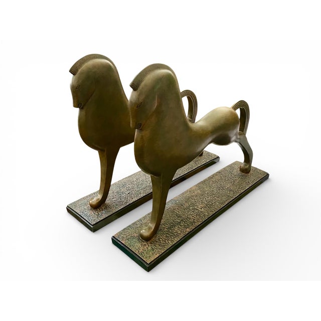 A striking pair of contemporary sculptural horses, drawing on classical equestrian forms and reinterpreted through a...