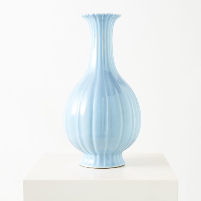Sky-Blue Glazed Melon-Form Vase A sky-blue porcelain melon-form vase in the style of the Qianlong period, with a globular...