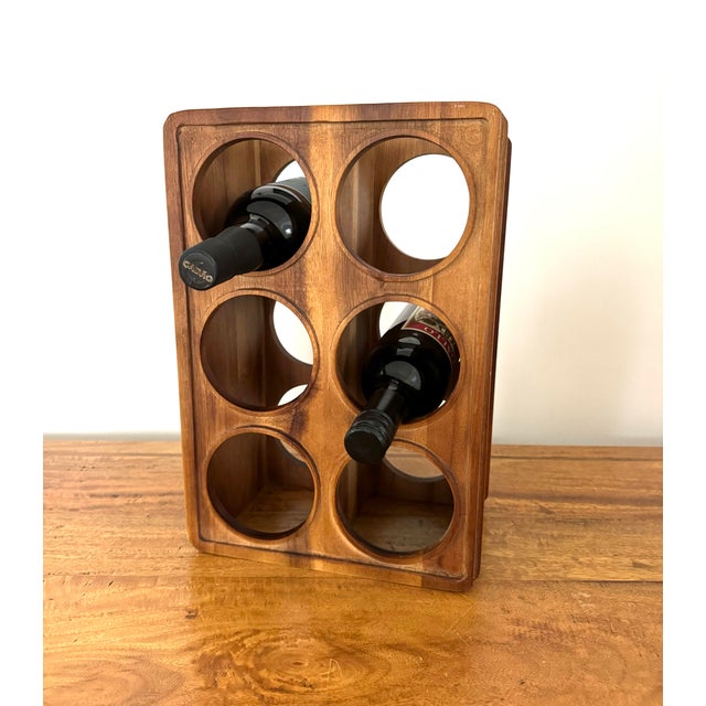 Handsome vintage midcentury wine rack, made from walnut. Holds six bottles and is designed to stand tall or on side....