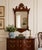 Vintage Chippendale-style mahogany wall mirror, circa 1950, featuring a beautifully shaped fretwork frame with scrolling...