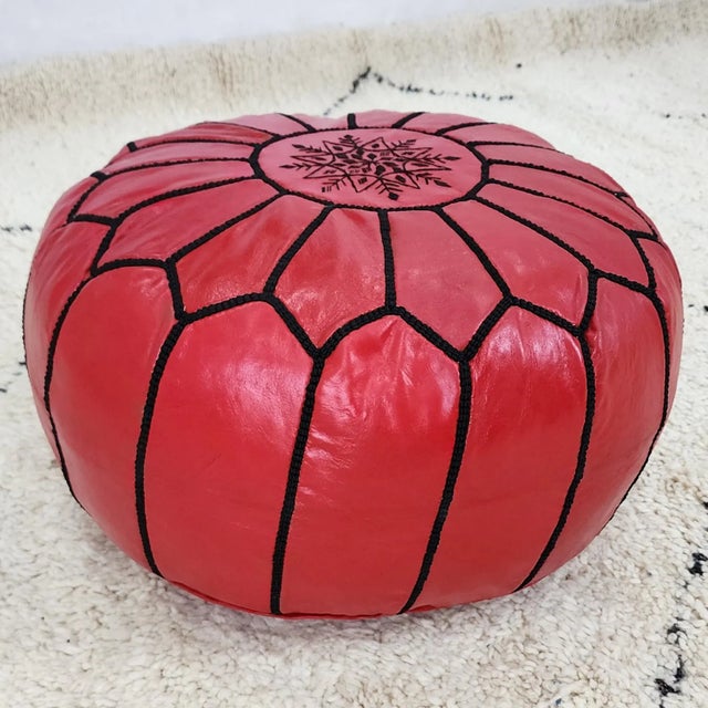 This handcrafted Moroccan leather pouf cover is made from genuine goat leather and traditionally hand-stitched by skilled...