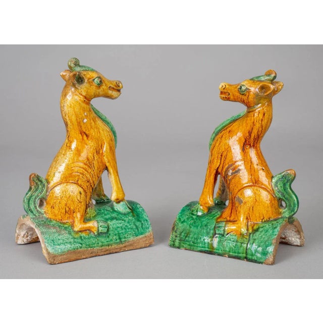 Charming pair of Chinese Qing dynasty Guangxu period pottery roof tiles in the form of horses sitting on their haunches...