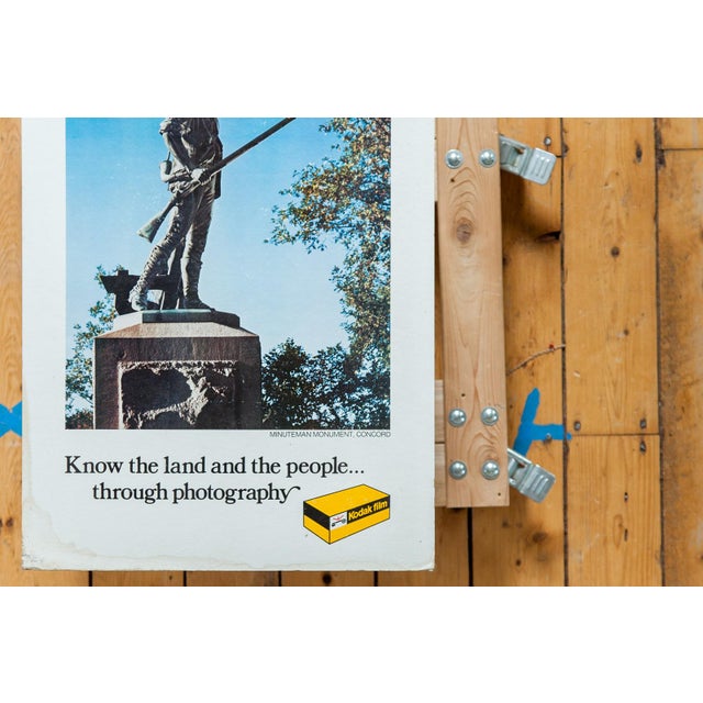 :: Take a trip back in time with this classic Kodak film advertisement, featuring a photograph of the minuteman monument,...