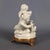 A refined capodimonte porcelain figurine with a glossy finish. This piece is an elegant decorative ornament of italian...