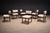 A refined and quietly sculptural set of eight Tião dining chairs by Sergio Rodrigues, executed in richly grained Brazilian...