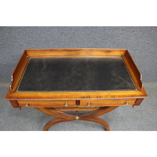 Campaign style bar server by Jasper Cabinet Company, crafted from solid mahogany with a warm antique finish. The piece...