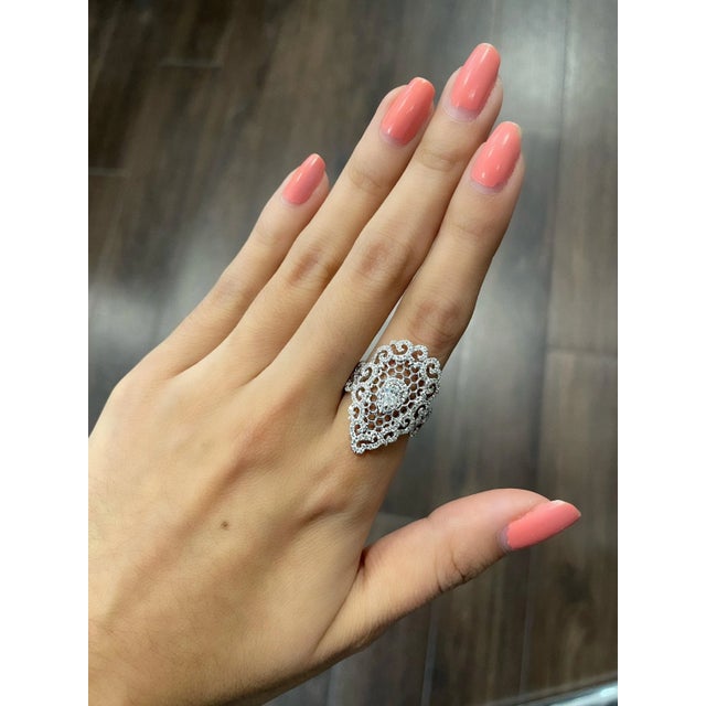 Add a touch of elegance to your jewelry collection with this stunning 1.22 ctw pear diamond ring. Crafted with 18k white...