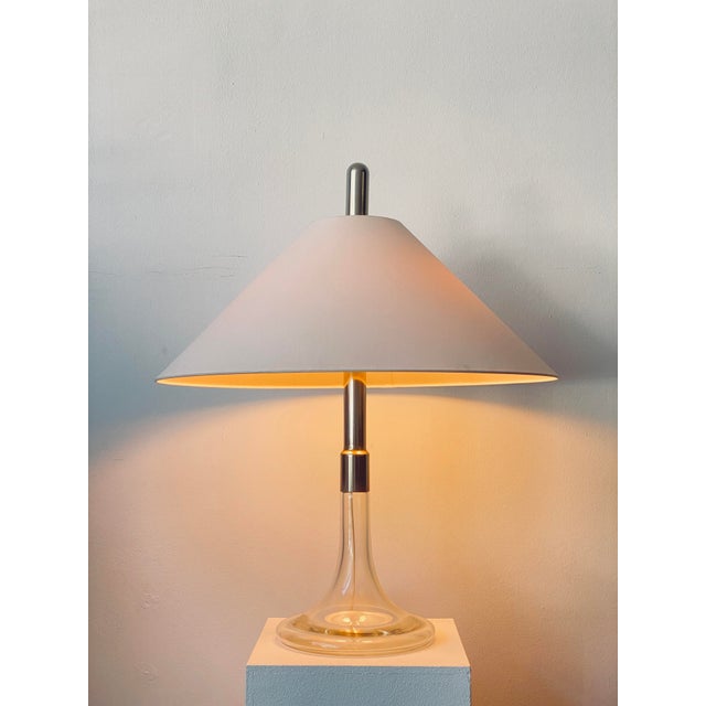 An early design by Ingo Maurer for Design M. Table lamp model “ML3” from the 1960s, distinguished by its elegant, curved...