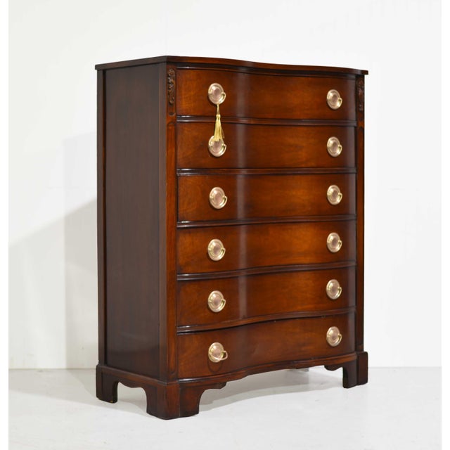A refined blend of classic curves and mid century ease, this Kent Coffey tallboy from the Darlington Collection features a...