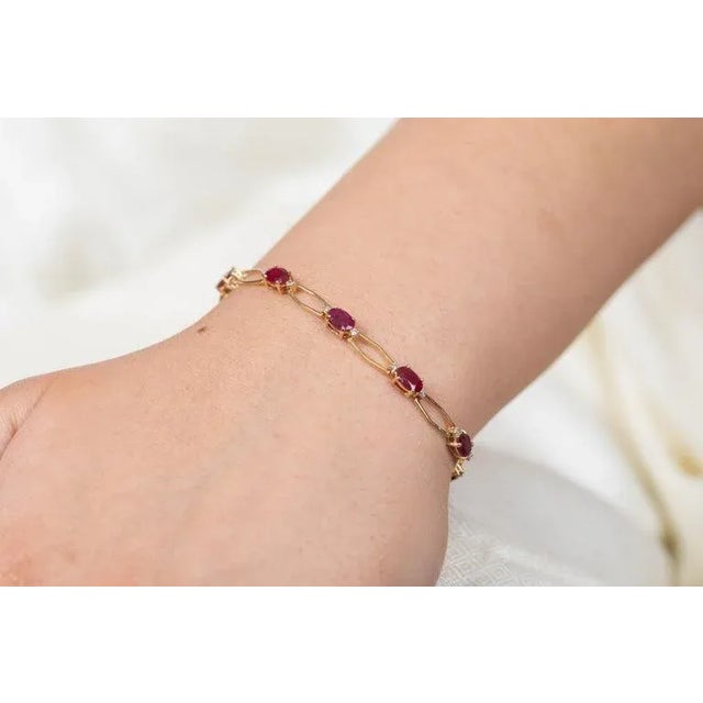 This is part of Chairish’s Fine Jewelry assortment. This Ruby Diamond Tennis Bracelet in 14K gold showcases 11 endlessly...
