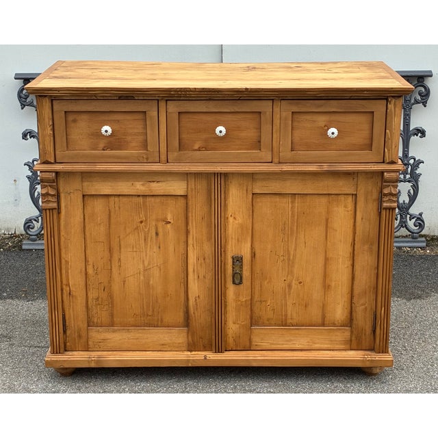 This handsome sideboard has considerable presence and the three drawers over two doors configuration is particularly...