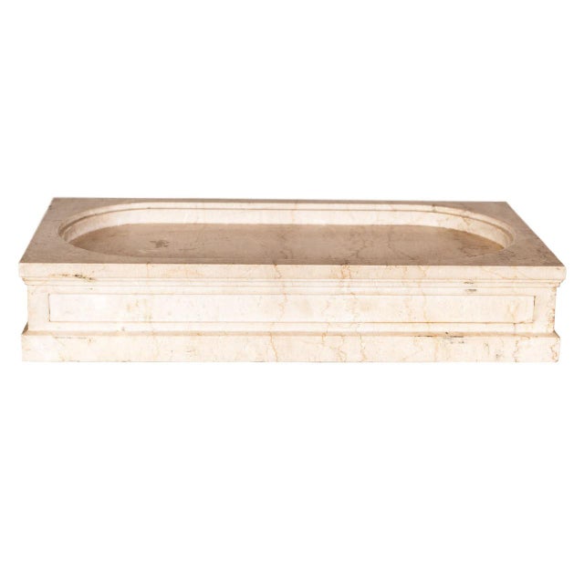 Hand-chiseled Empire stone paneled clock base.