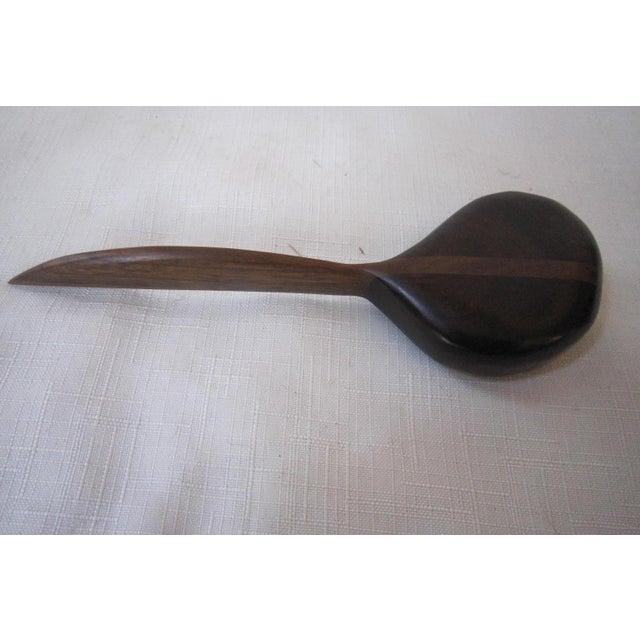 Gorgeous pair of Artisan carved wood letter openers (pair). each is carved from walnut and has a smooth, organic finish....