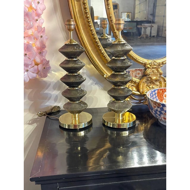 Beautiful pair of modern Murano smoke glass and brass lamps. Lovely textured glass and very fine quality. Creates an...